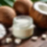 Coconut oil in a small glass jar next to fresh coconuts