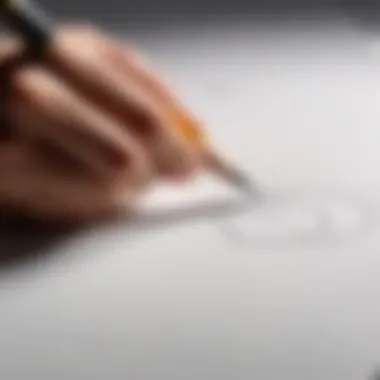 Close-up of a hand sketching a basic shape on paper