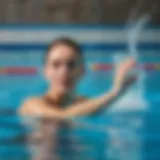 Demonstration of butterfly stroke technique in a pool