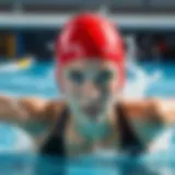 A beginner swimmer practicing the freestyle stroke in a pool