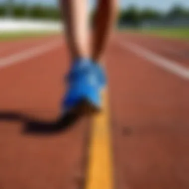 A close-up of running shoes on a track