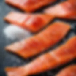 A close-up of red fish fillets sprinkled with salt and sugar