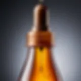 Close-up of a dropper bottle with tanning drops