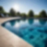 A serene swimming pool reflecting a clear blue sky