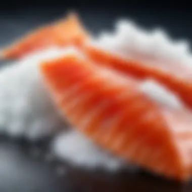 Close-up of salt and sugar with a backdrop of fresh fish