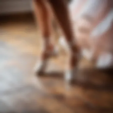 Close-up of feet demonstrating the waltz dance technique on a wooden floor.